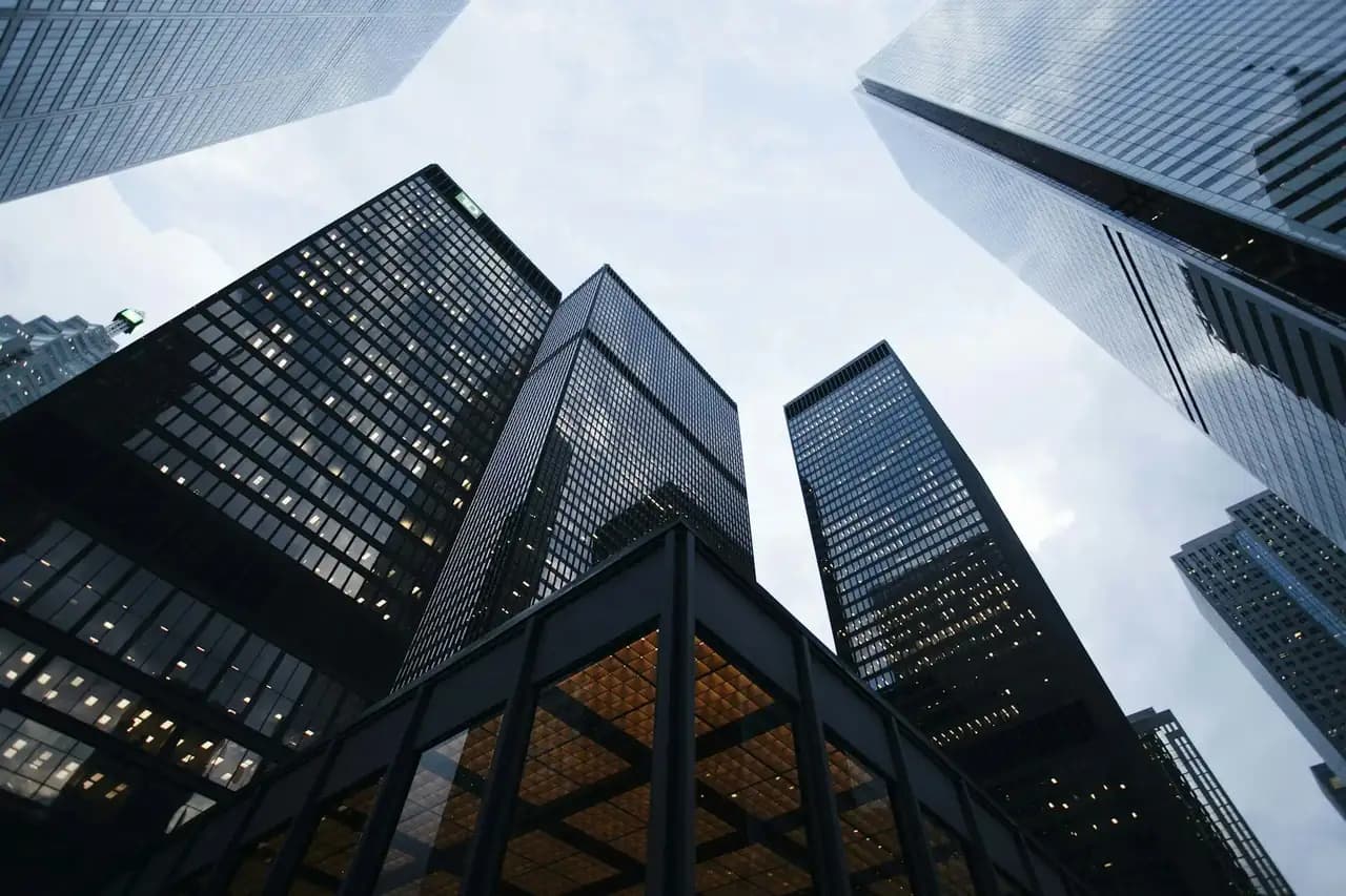 Modern glass office towers — VALTEC FM facilities backdrop