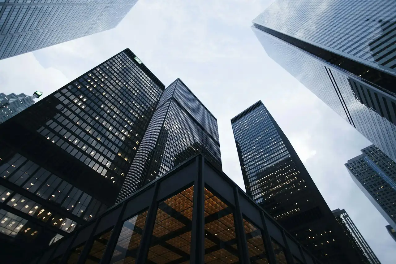 Modern glass office towers — VALTEC FM facilities backdrop